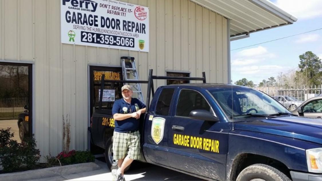 Guy standing beside truck